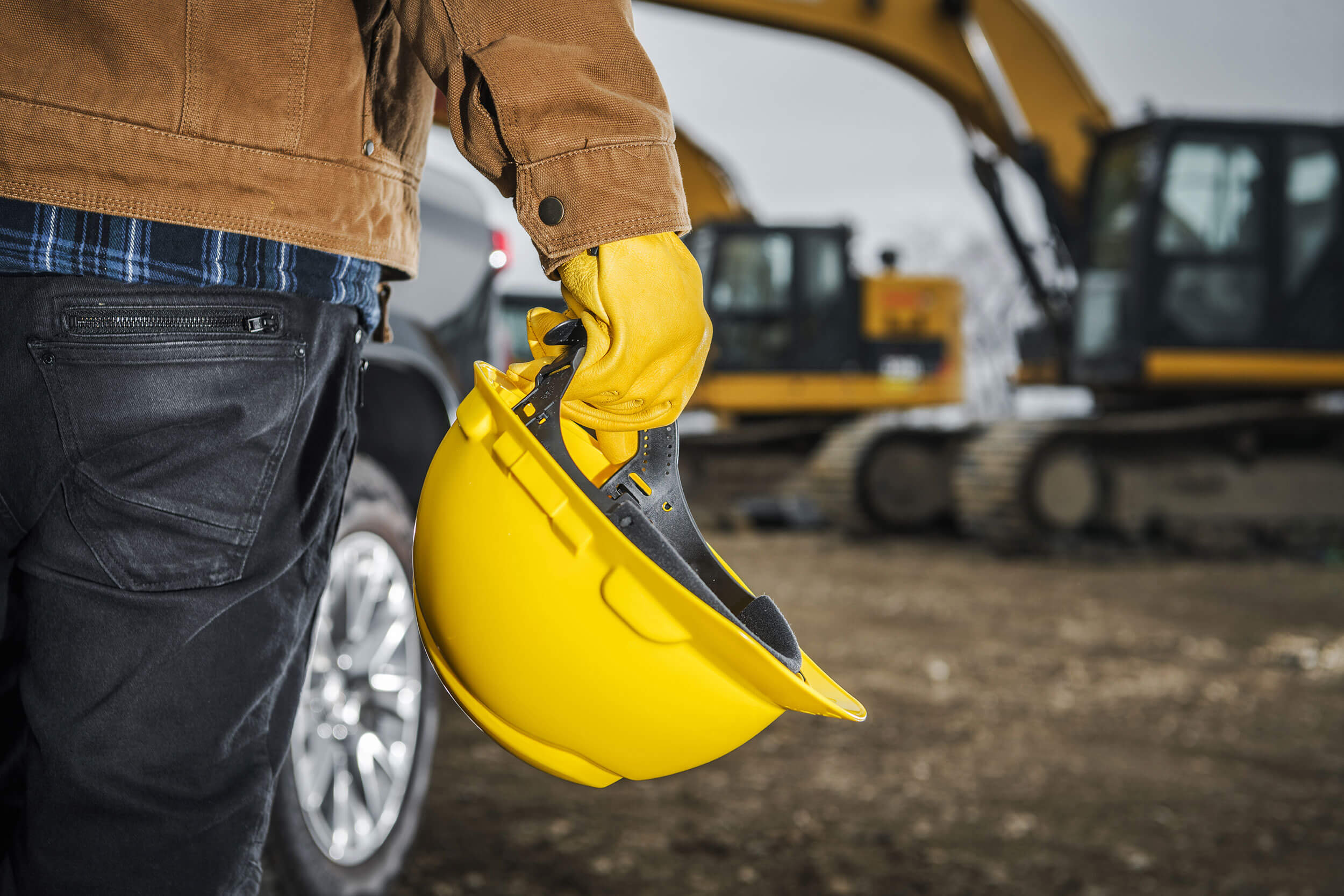 man holding hard hat